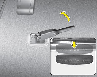 Kia Carnival: Removing the spare tire Kia Carnival: Removing the spare tire. 3. Use the wheel lug nut wrench to loosen the bolt enough to lower the spare