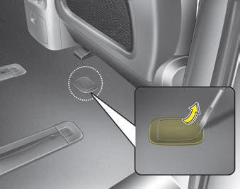 Kia Carnival: Removing the spare tire Kia Carnival: Removing the spare tire. Your spare tire is stored underneath your vehicle, directly below the right sliding